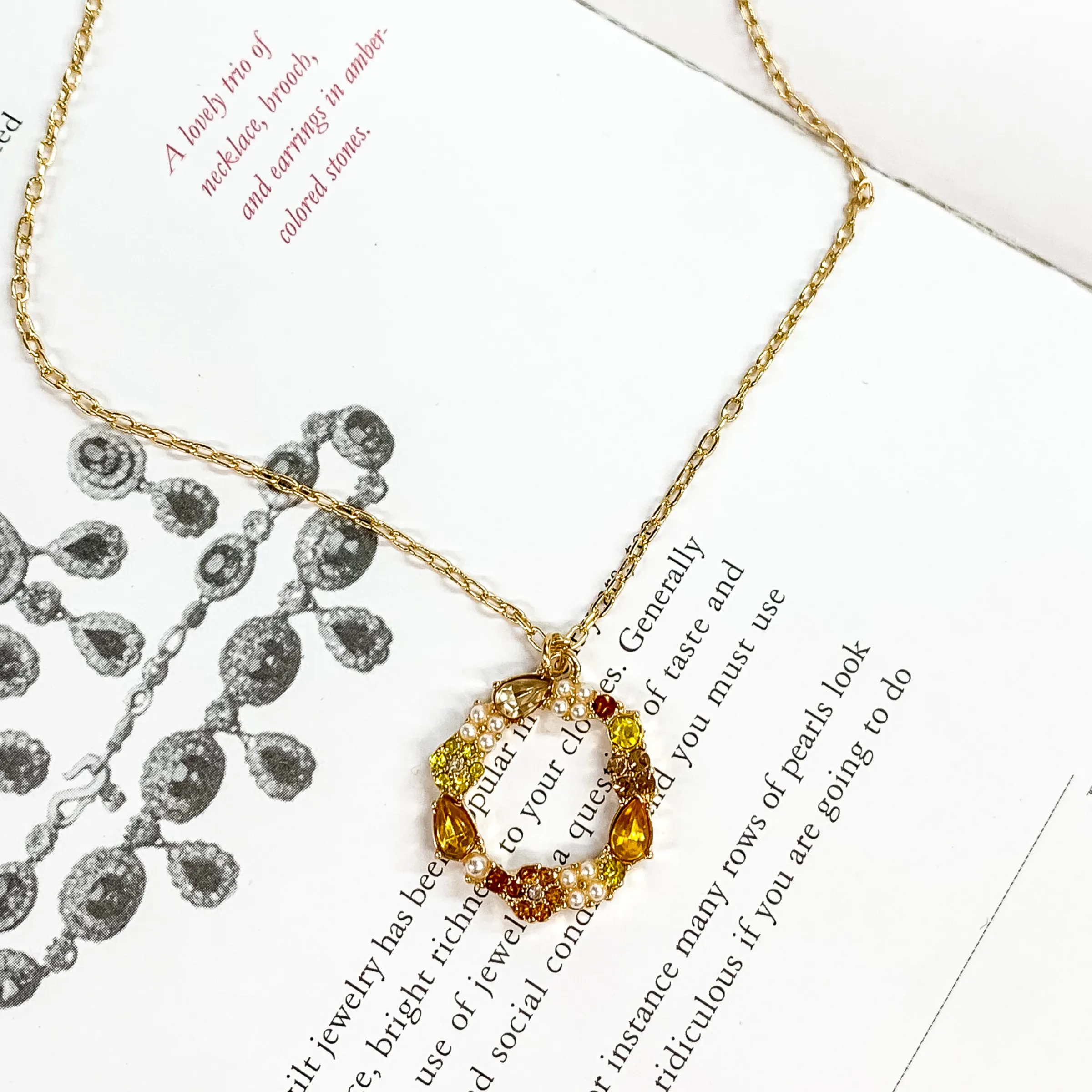 Gold Tone Chain Necklace and Open Circle Pendant with Topaz Crystals