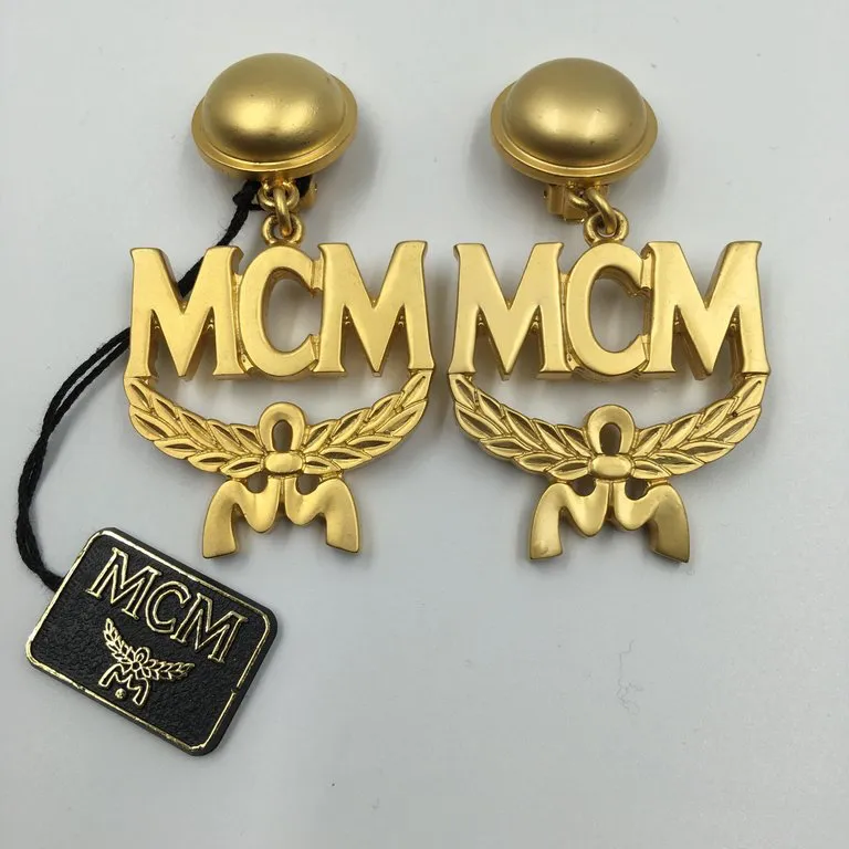 MCM Wreath Logo Matte Gold Tone Clip On Earrings