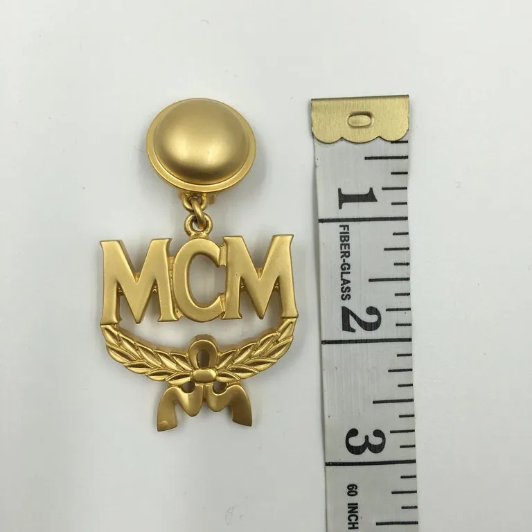 MCM Wreath Logo Matte Gold Tone Clip On Earrings