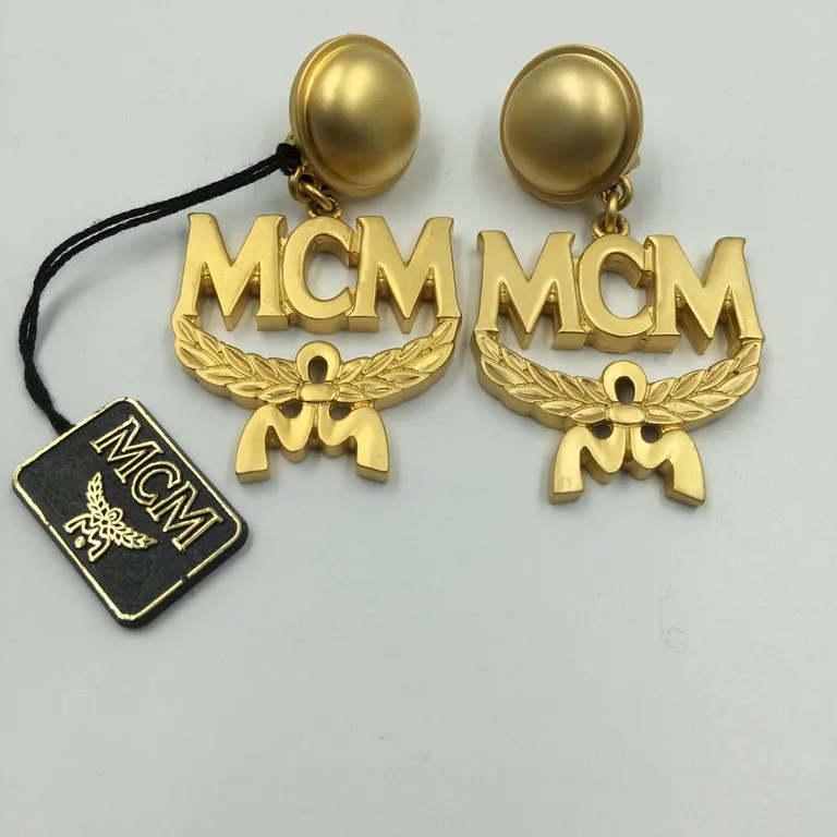 MCM Wreath Logo Matte Gold Tone Clip On Earrings