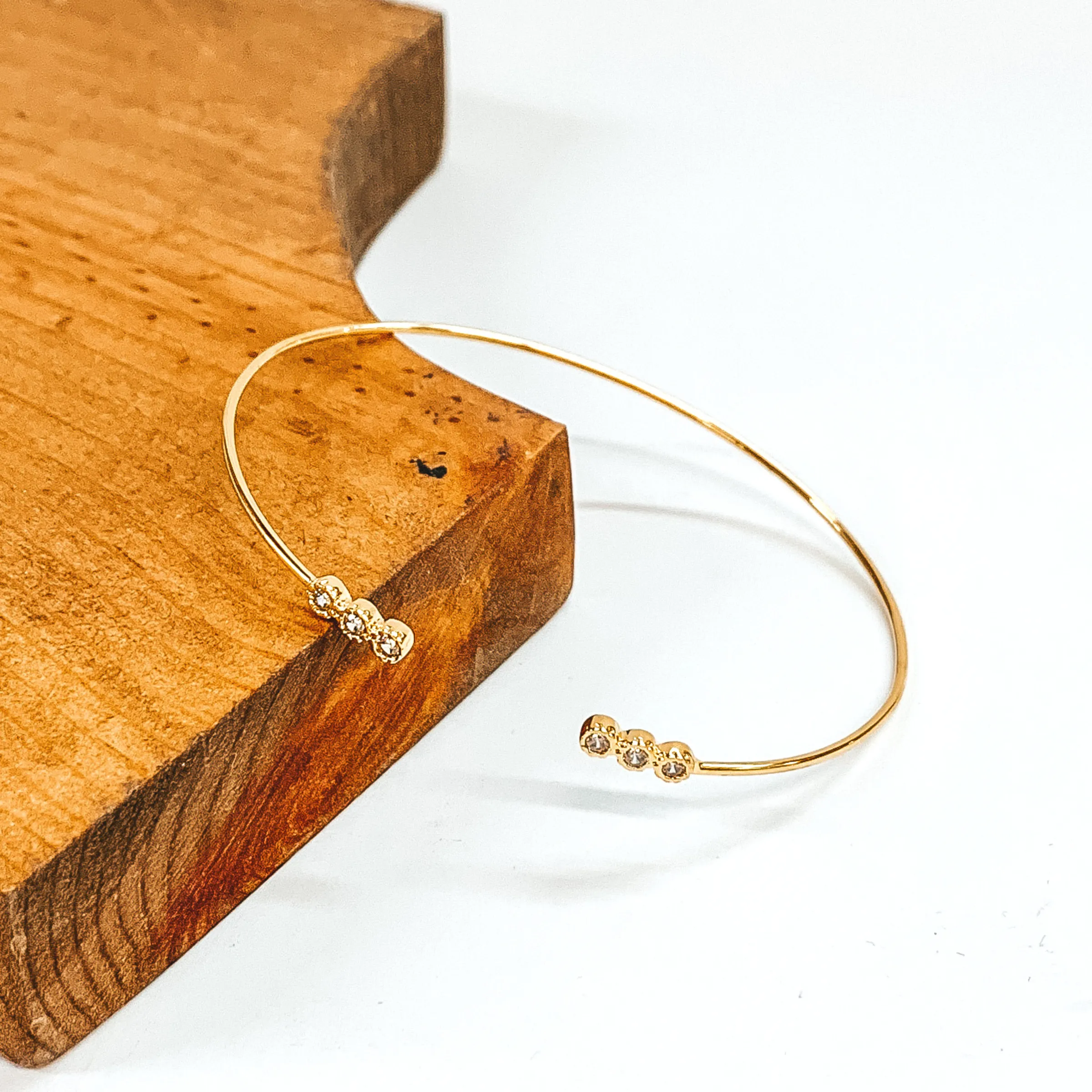 Thin Wire Bangle with Tiny Clear Crystal Ends in Gold Tone